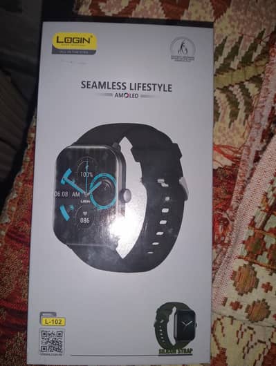 Login L-102 with box, 1 charger, warrenty card and two silicon straps