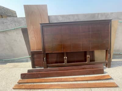 wooden bed in good condition