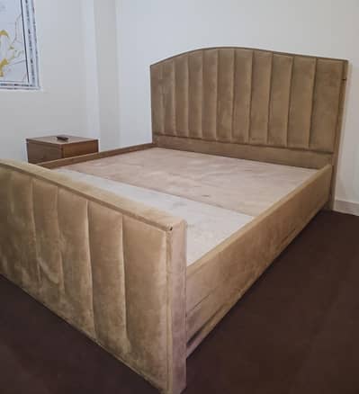 Double bed with mattress and  side table