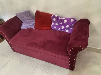 Maroon velvet sofa