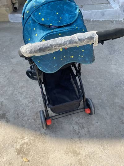 Tinnies stroller / pram . Acid blue colour