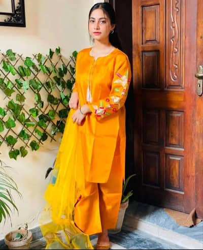 mustard silk embroidered women's stitched suit  3 pic