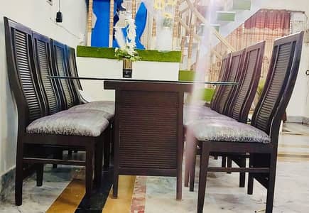 8 MM DOUBLE GLASS DINNING TABLE AND 8 CHAIRS WOODEN. BEHREN CONDITION