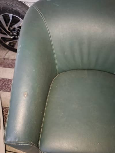 green leather single sofa