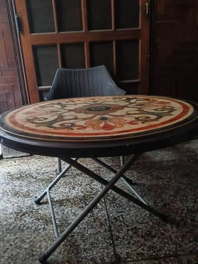 4 grey plastic chairs and table set.