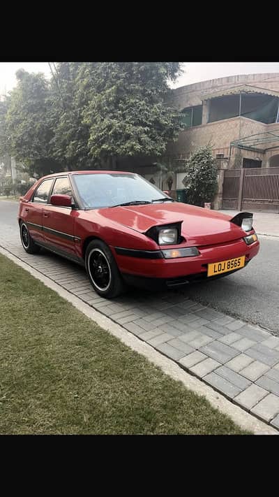 Mazda 323 Astina 4 door coupe