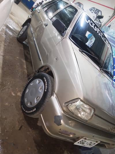 Suzuki Mehran vxr model 2015 register 2016 golden color outer side