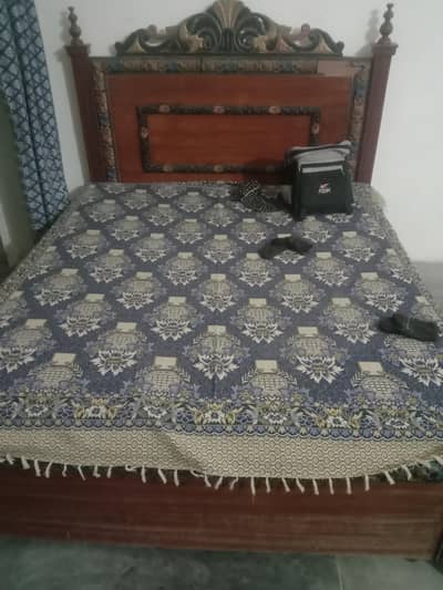 bed with mattress and bed sheets
