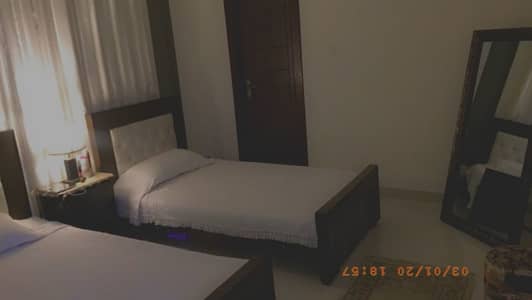 Two Single Beds with a Side Table