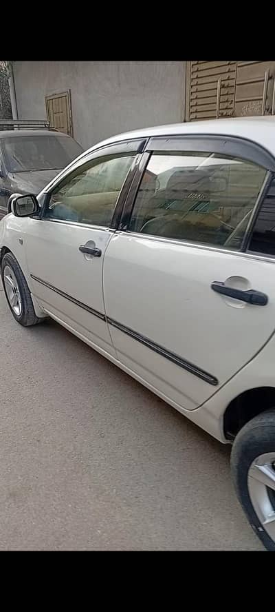 Corrola Gli 2005  outside pillar,diggi,bonut,4doors,1 fender genuin