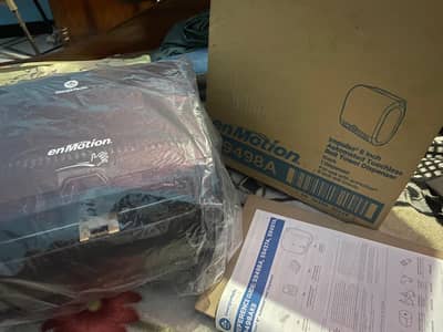 ROLL TOWEL DISPENSER  AMERICAN BRAND ENMOTION