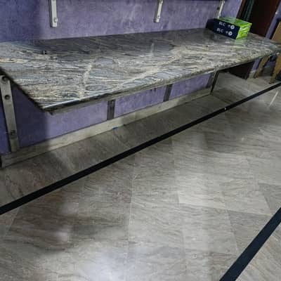 granite top with stainless steel wall fittings table
