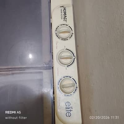 Homage washing machine with attached dryer