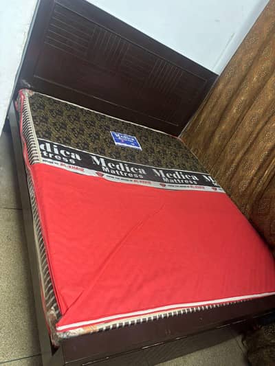 Double Bed with mattress excellent condition.