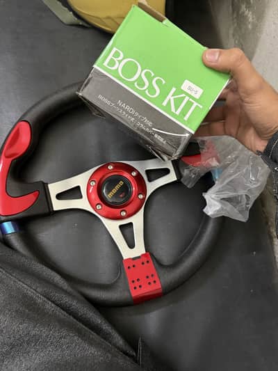 Red Momo streeing wheel new 10by 10 never been used with boss kit
