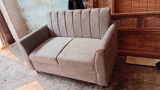 2seater sofa elegant design available in grey colour.