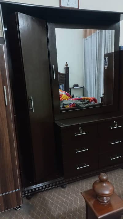 new wooden cupboard with moving mirror