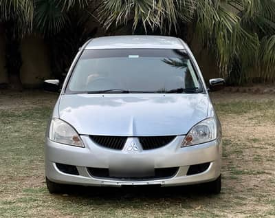 Mitsubishi Lancer GL 2004 model, 1300cc Manual in excellent condition.