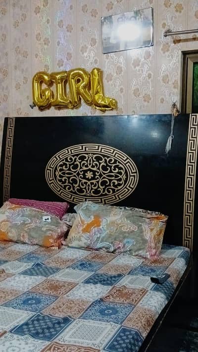 A wooden Bed With dressing