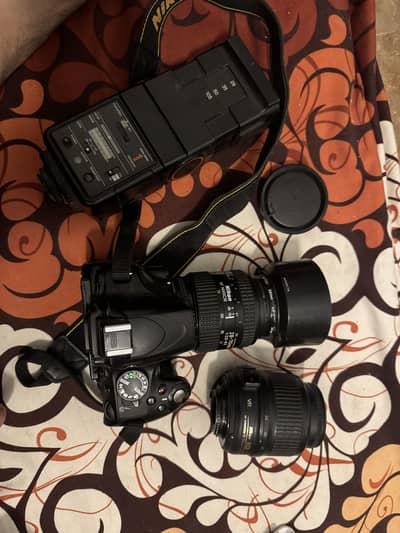 Nikon D5100 with lenses and flashgun
