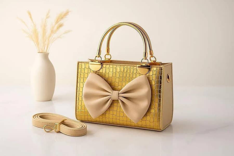 فیشن ایبل بلیک ہینڈ بیگ گولڈ ہارڈویئر اور باؤ باؤ ڈیزائن کے ساتھ" 4