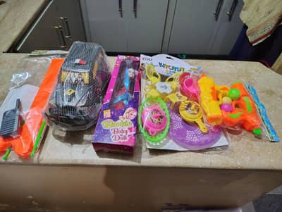 set of 5   1- Doll 2- double ball gun 3- Arrow gun set 4 - car 5-kitch