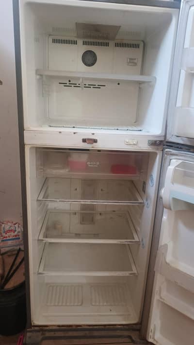Full size used fridge but good condition 10/9