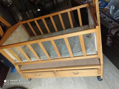 Baby swing cot bed with 2 drawers