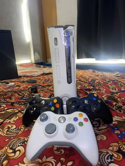 Xbox 360 with 3 controllers and pre installed games