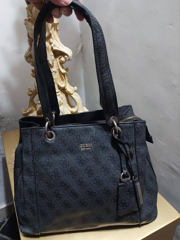 Branded coded guess bag 1