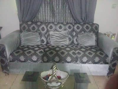 5 seater sofa set with glass center table and curtain
