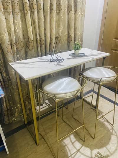 Coffee table with bar chairs