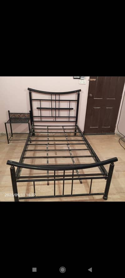 single iron bed & 1 side table