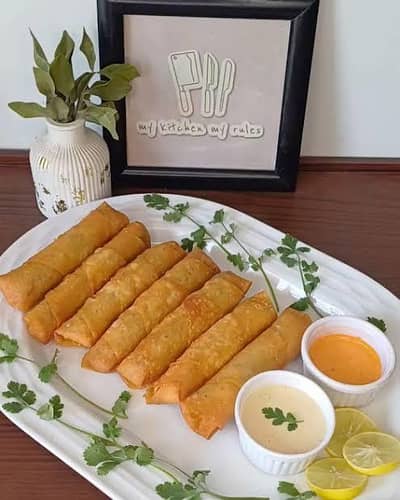 Home made frozen samosa and  chicken rolls