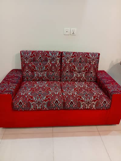 Beautiful red print 2 seater sofa for sale