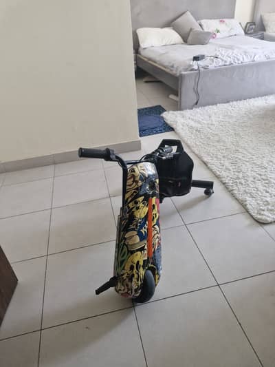 Electric drifting Scooty for kids 7-14 years good condition