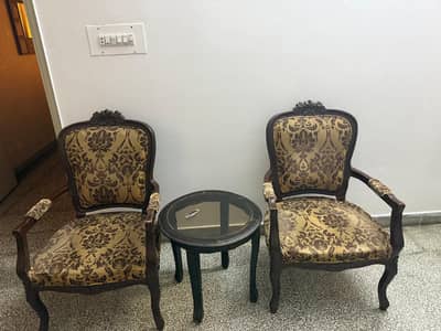2 chairs with table
