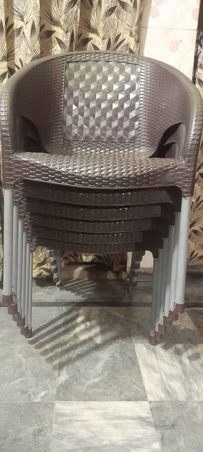 Five + one free (6) Plastic Chairs and one table