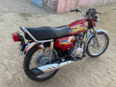 Honda 125 10/9 Nwe with number