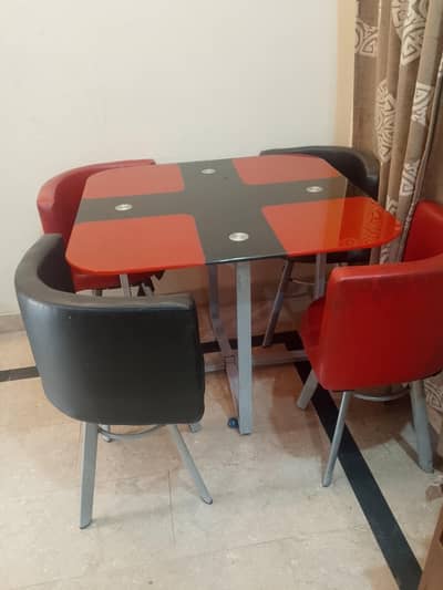 Smart and elegant 4 chairs and glass top dining table set