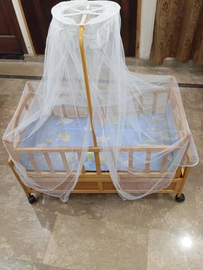 Wooden Baby Coat with Mosquito Net and Wheels. (Contact 03247070350)
