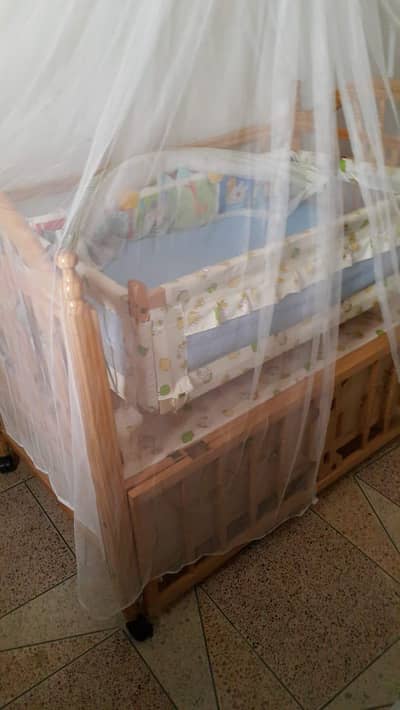 baby cot with swing and carry cot