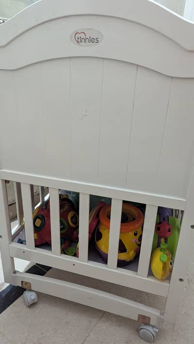 tinnies cot with mattress and bedding plus sides with storage space