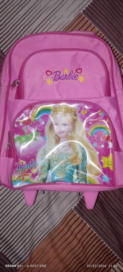 SLIGHTLY USED PINK COLOUR TROLLEY BAG FOR SALE