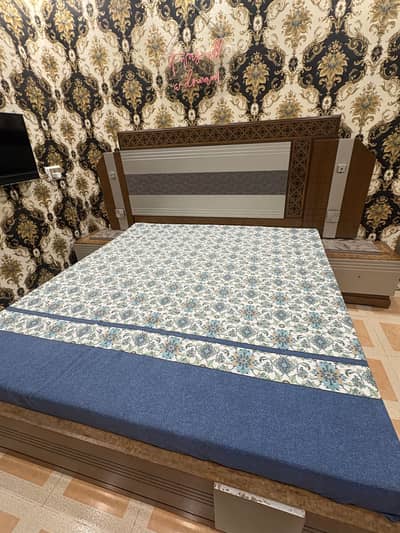 bed with side table and mattress