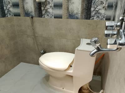 12 marla lower portion prime location canall road available for rent near ALFATHA MALL johar town.