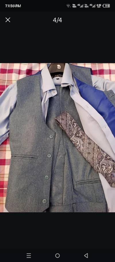 3 Piece suit complete with 2 shirts and 2 ties.