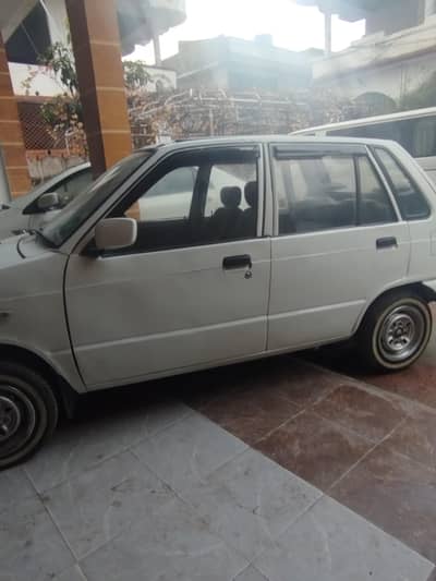 mehran 2009 below Piller paint in good condition,non accidental