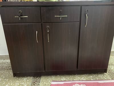 Wooden table with drawers and lock