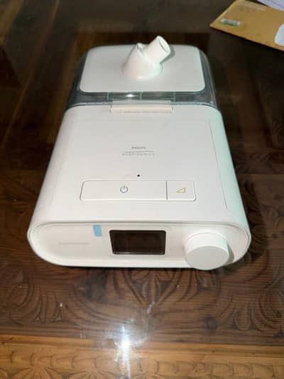 Philips Respironics DreamStation CPAP machine with a humidifier